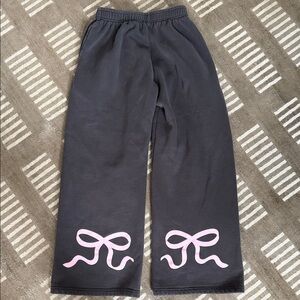 Edikted Gray wide leg sweatpants with cute pink bows on the back of each leg.